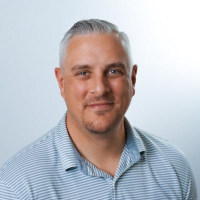 Portrait image of man smiling.